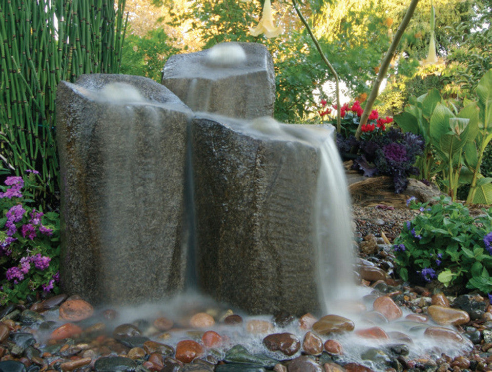 backyard oasis with waterfall fountains