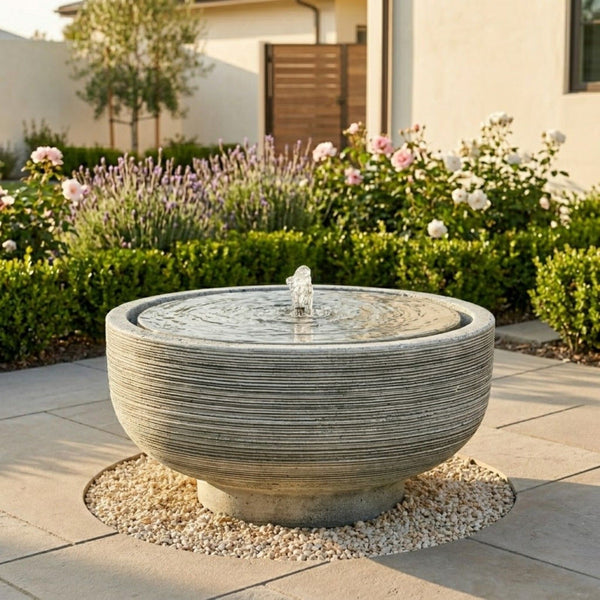 Timeless outdoor fountain in landscaped setting